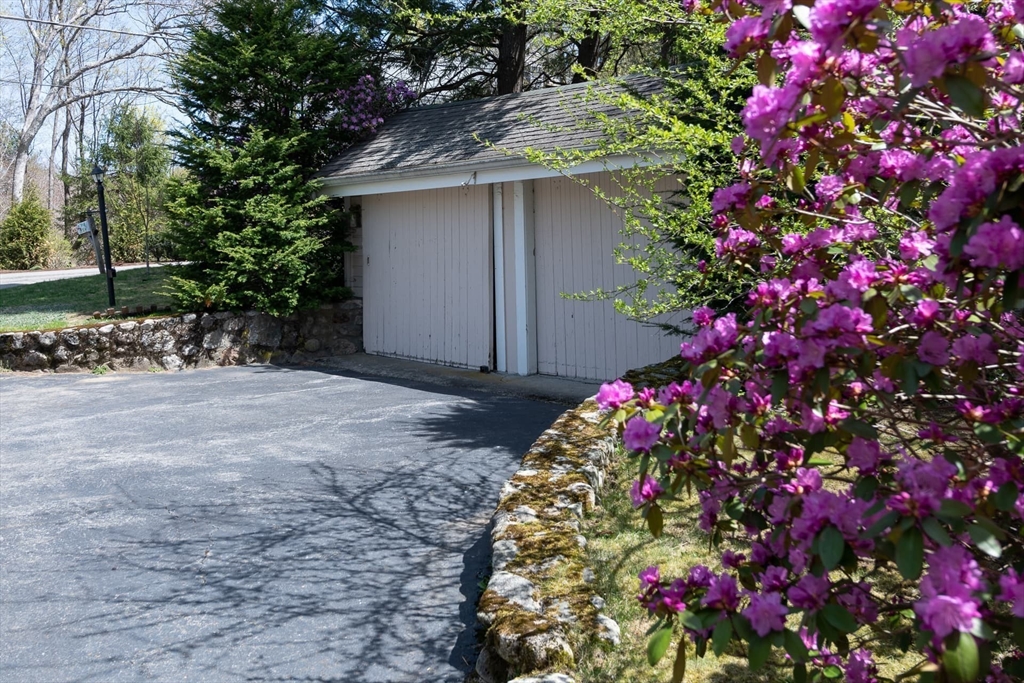 20 Maple Road Weston, MA 02493 - Photo 41 of 42 a front view of a house with lots of flowers