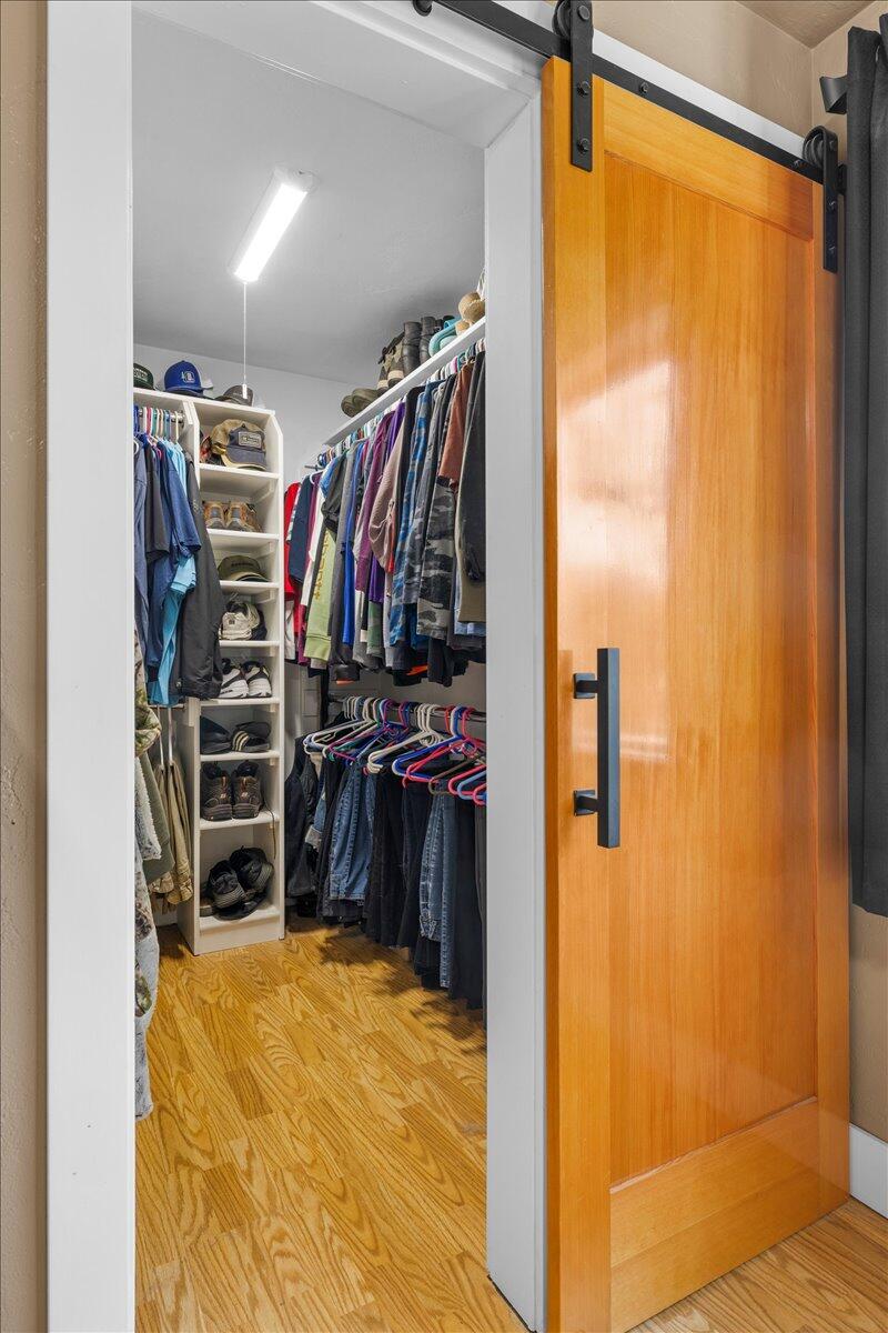 1360 Oxyoke Road Grants Pass, OR 97526 - Photo 22 of 39 a view of walk in closet with clothes and shoes