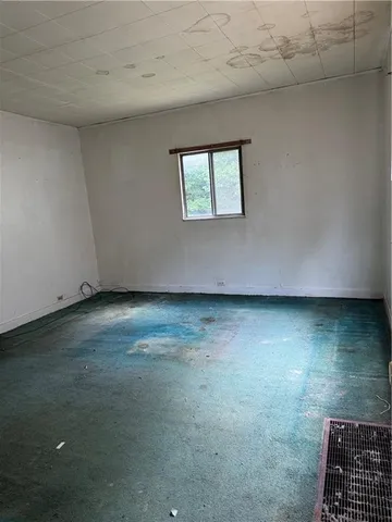 a kitchen with granite countertop a sink and cabinets