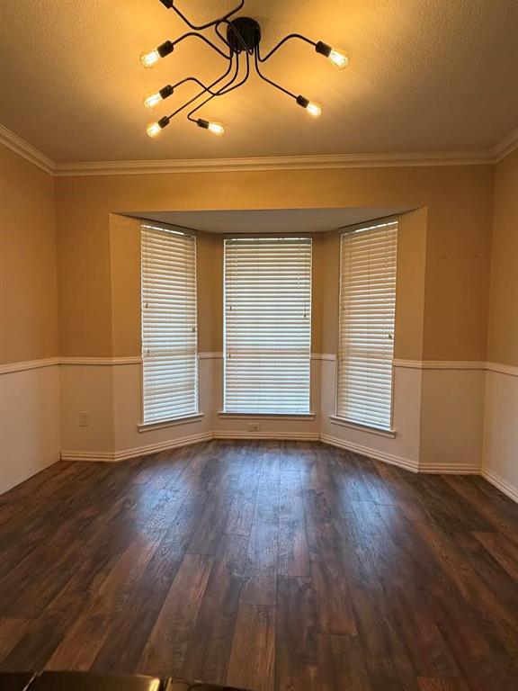 200 Red Oak Creek Road Oak Leaf, TX 75154 - Photo 4 of 11 an empty room with wooden floor and windows