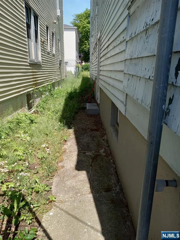 69 Hobson Street Newark, NJ 07112 - Photo 16 of 23 a view of a pathway with a house