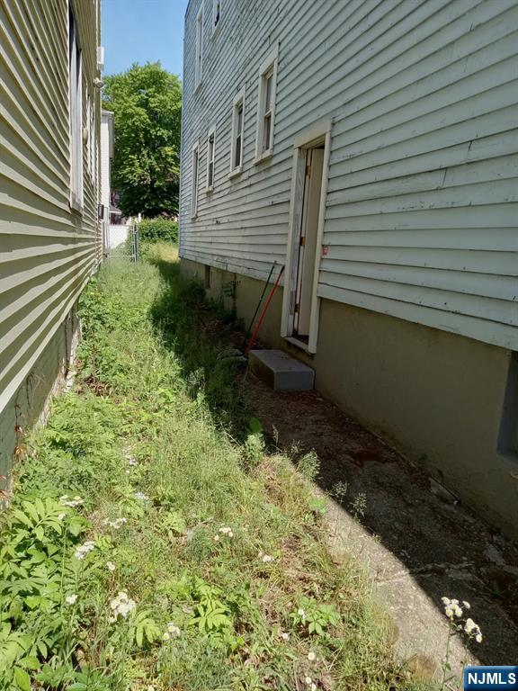 69 Hobson Street Newark, NJ 07112 - Photo 18 of 23 a view of a backyard with plants