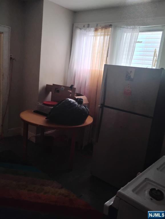 69 Hobson Street Newark, NJ 07112 - Photo 20 of 23 a room with wooden floor and a window