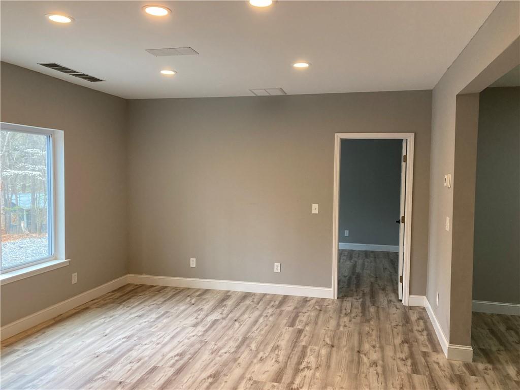 100 B Dickerson Road Dahlonega, GA 30533 - Photo 6 of 11 wooden floor in an empty room with a window