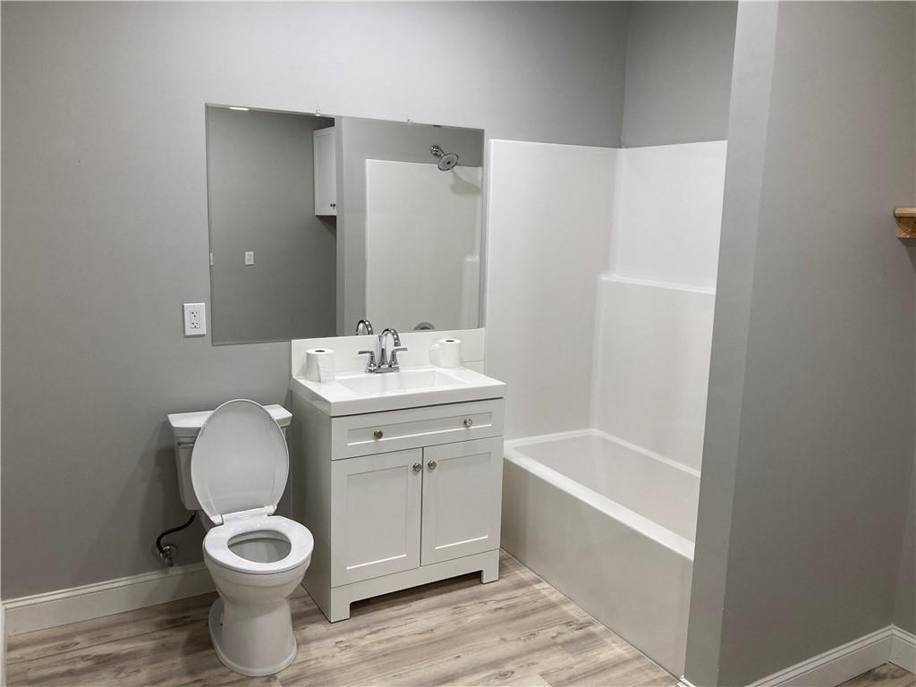 100 B Dickerson Road Dahlonega, GA 30533 - Photo 10 of 11 a bathroom with a sink toilet and shower