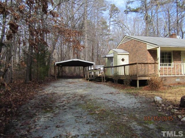 1427 Dirgie Mine Road Roxboro, NC 27574 - Photo 2 of 13 a view of house with yard and sitting area