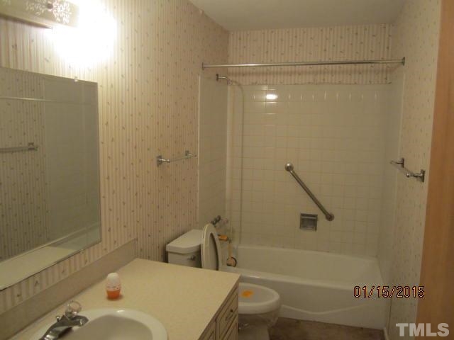 1427 Dirgie Mine Road Roxboro, NC 27574 - Photo 11 of 13 a bathroom with a sink and a toilet