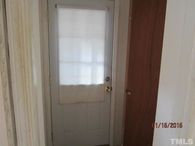 1427 Dirgie Mine Road Roxboro, NC 27574 - Photo 12 of 13 a bathroom with a glass door