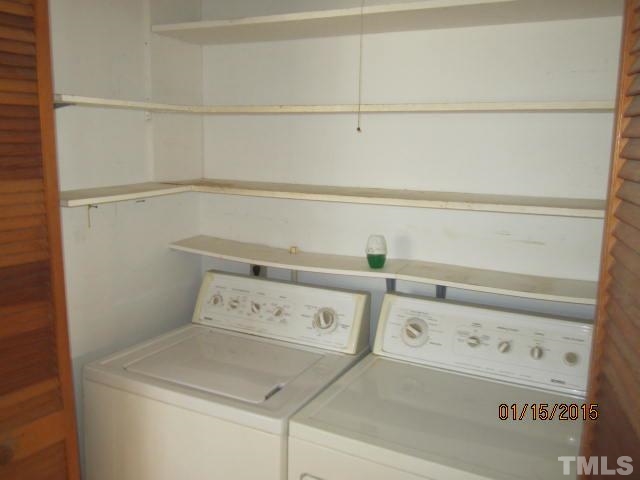 1427 Dirgie Mine Road Roxboro, NC 27574 - Photo 13 of 13 a utility room with dryer and washer