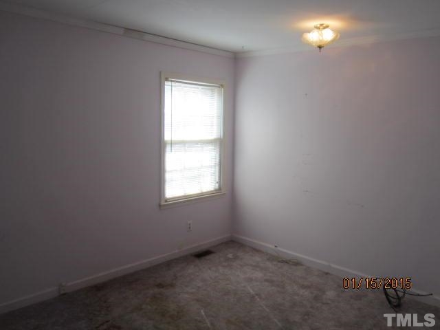 1427 Dirgie Mine Road Roxboro, NC 27574 - Photo 8 of 13 an empty room with a window