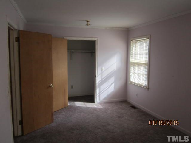 1427 Dirgie Mine Road Roxboro, NC 27574 - Photo 9 of 13 a view of an empty room with a window