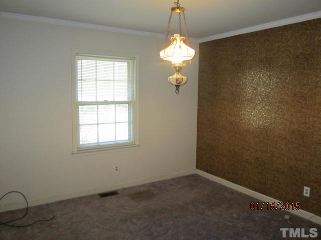 1427 Dirgie Mine Road Roxboro, NC 27574 - Photo 10 of 13 an empty room with a window