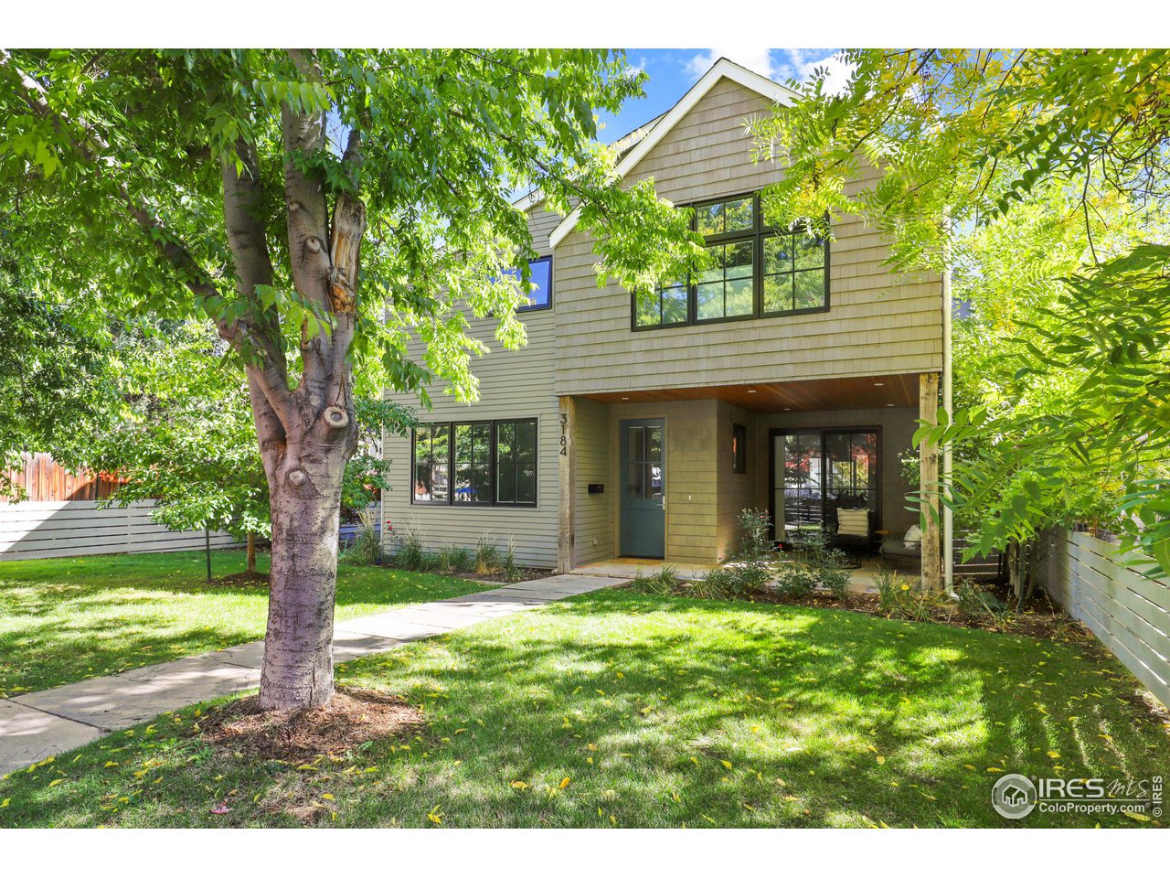 3184 9th Street Boulder, CO 80304 - Photo 1 of 39 a view of a house with backyard and a tree