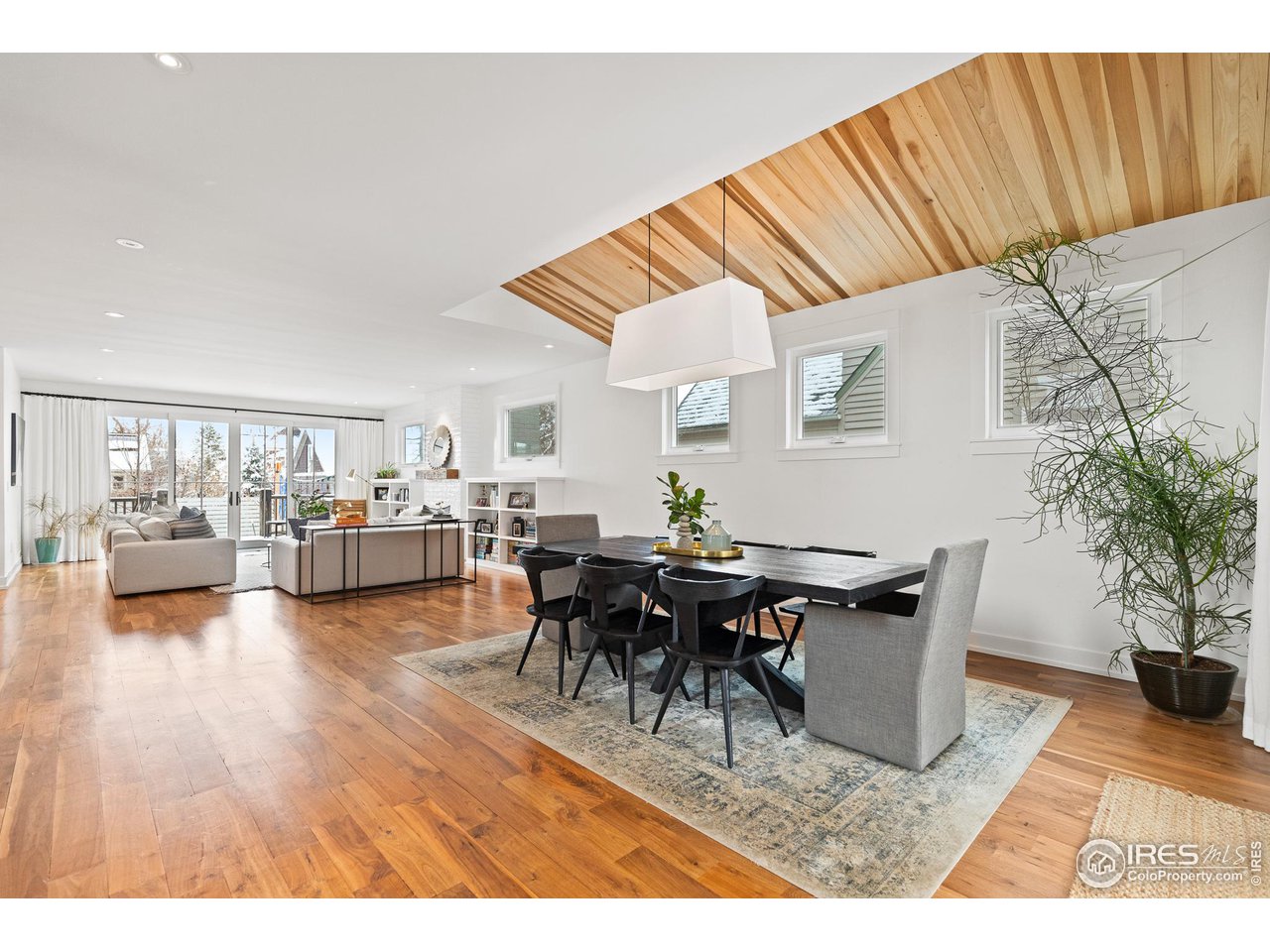 3184 9th Street Boulder, CO 80304 - Photo 11 of 39 a view of a dining room with furniture and wooden floor