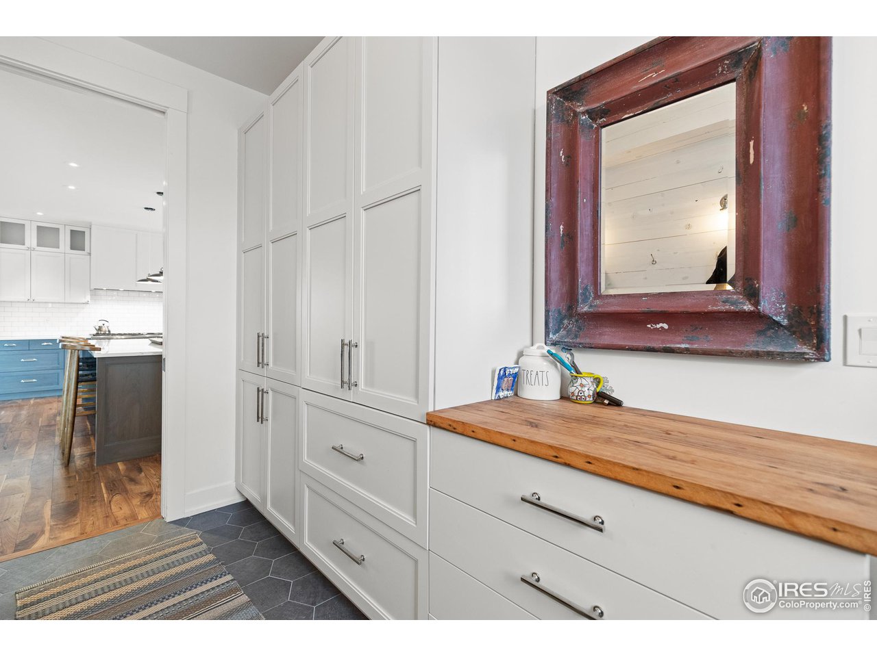 3184 9th Street Boulder, CO 80304 - Photo 17 of 39 a bathroom with a sink a mirror and a vanity