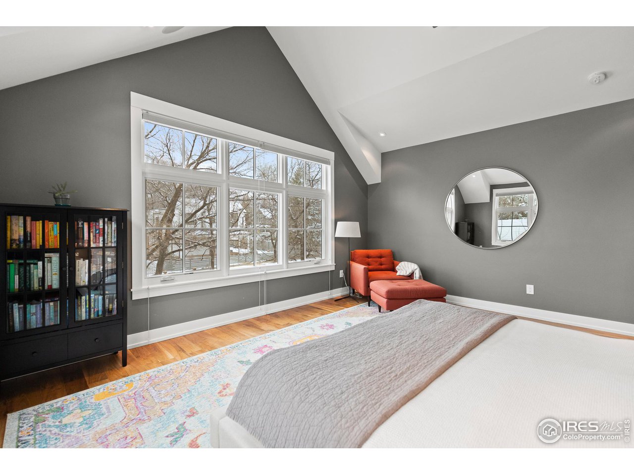 3184 9th Street Boulder, CO 80304 - Photo 25 of 39 a bedroom with a large bed and a large window