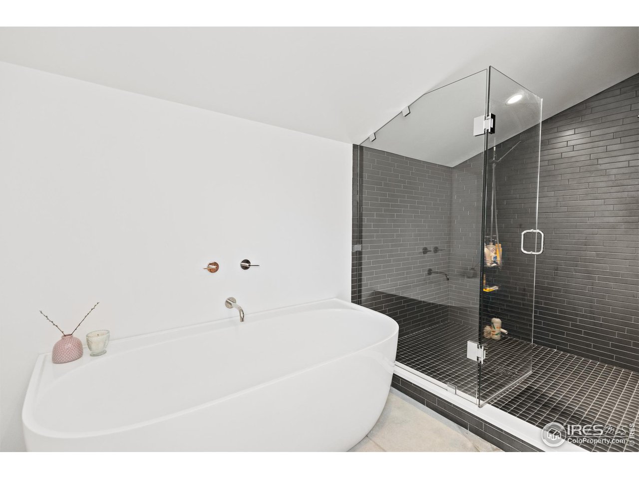 3184 9th Street Boulder, CO 80304 - Photo 27 of 39 a bathroom with a sink a toilet and shower