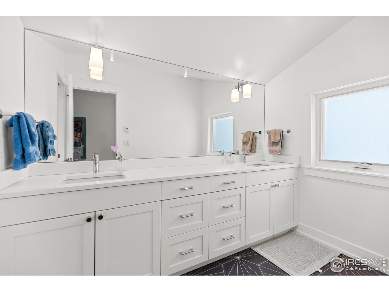 3184 9th Street Boulder, CO 80304 - Photo 30 of 39 a bathroom with a granite countertop sink vanity and mirror