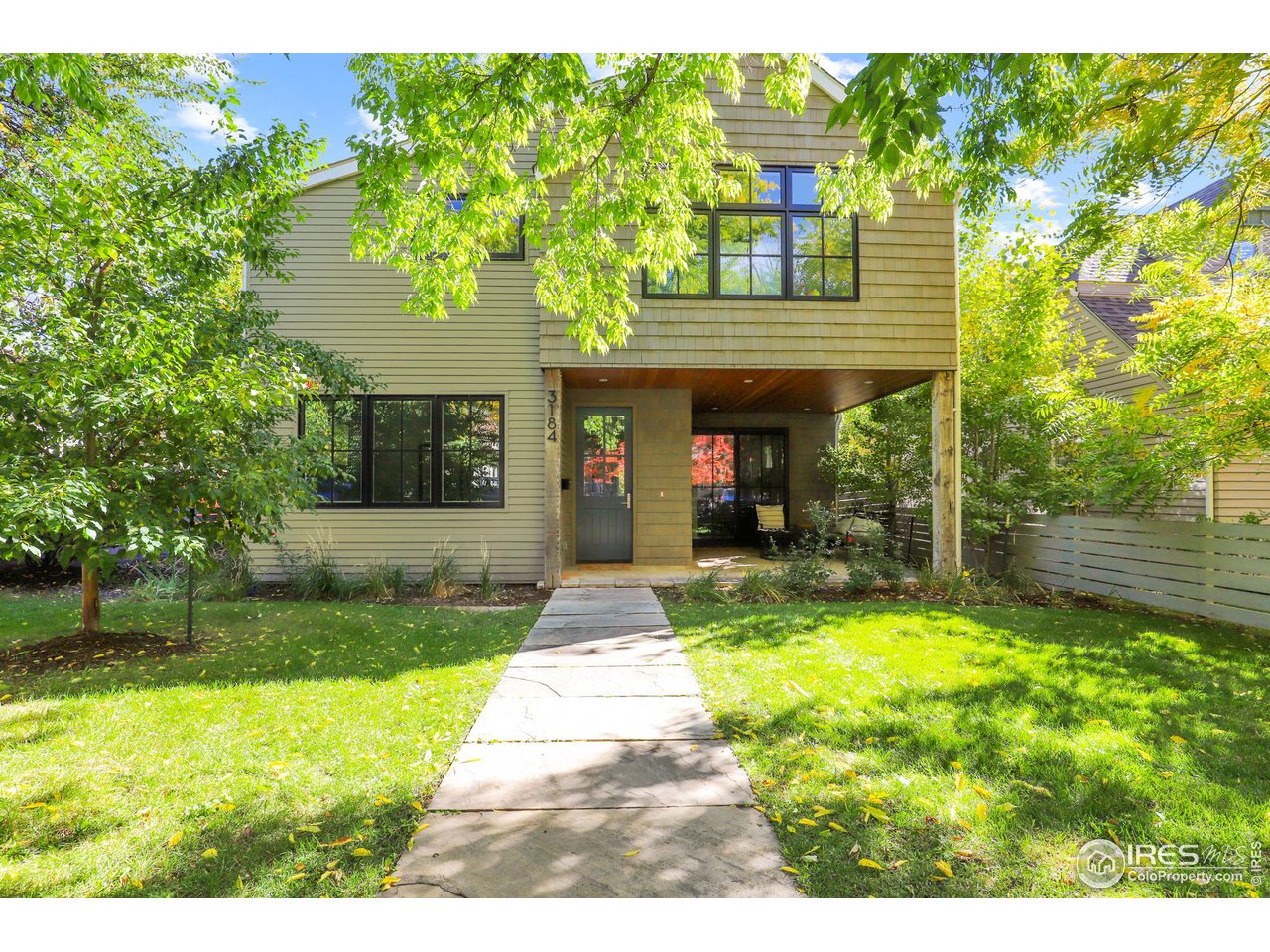 3184 9th Street Boulder, CO 80304 - Photo 31 of 39 a view of house with a yard