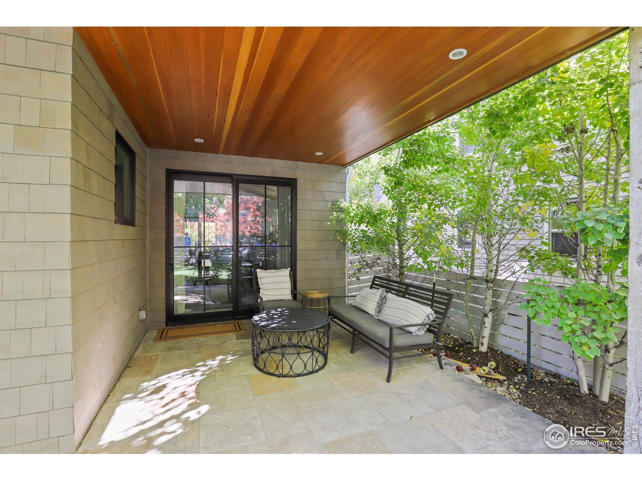 3184 9th Street Boulder, CO 80304 - Photo 32 of 39 a view of a patio with table and chairs and potted plants