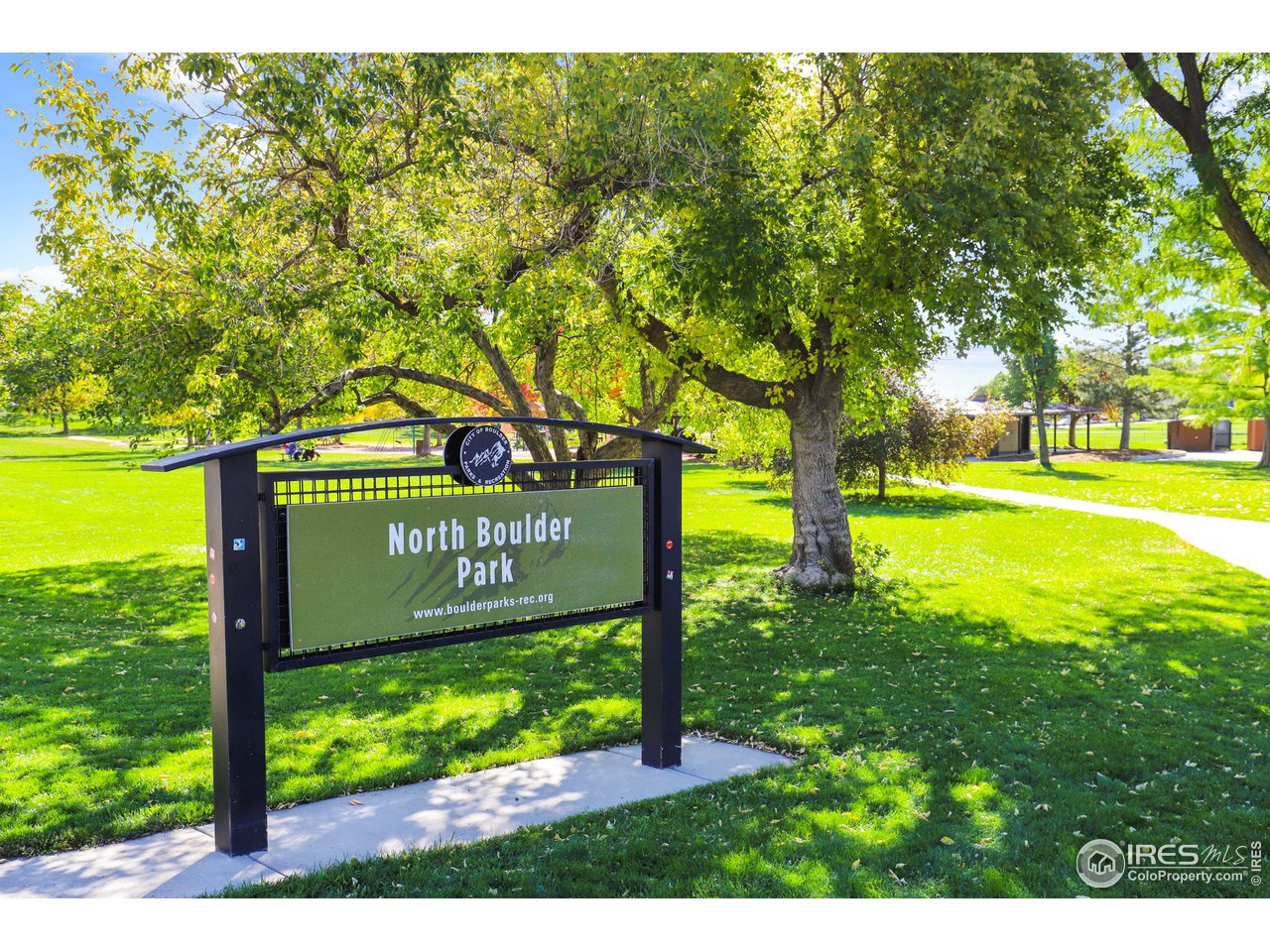 3184 9th Street Boulder, CO 80304 - Photo 34 of 39 a sign broad in front of yellow house