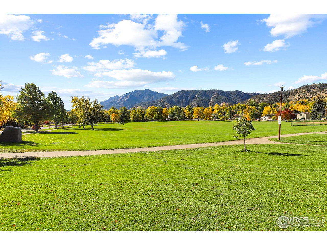 3184 9th Street Boulder, CO 80304 - Photo 37 of 39 a view of a golf course with a lake