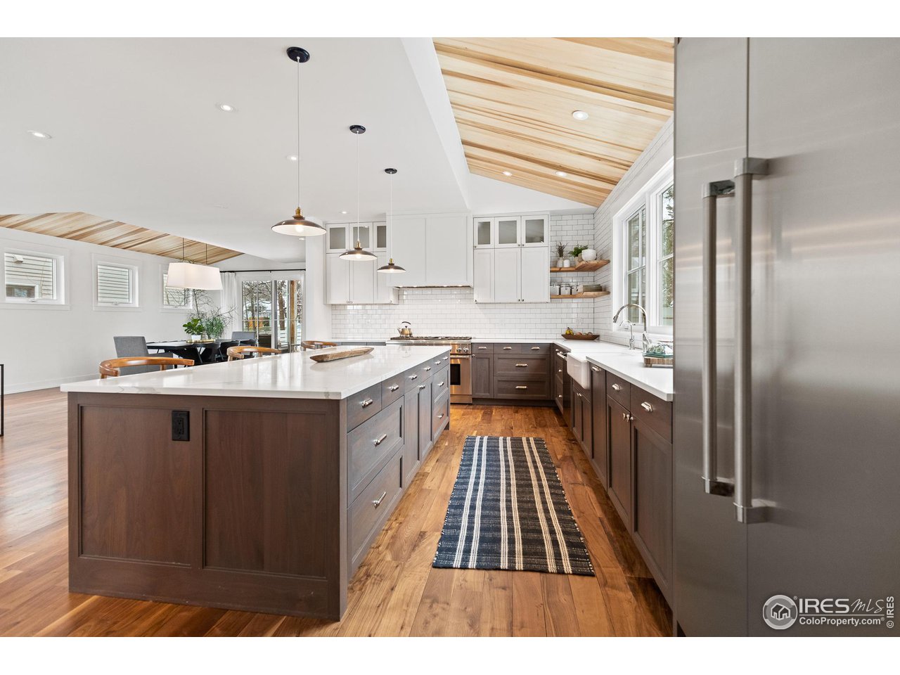 3184 9th Street Boulder, CO 80304 - Photo 7 of 39 a kitchen with stainless steel appliances granite countertop a refrigerator and a sink