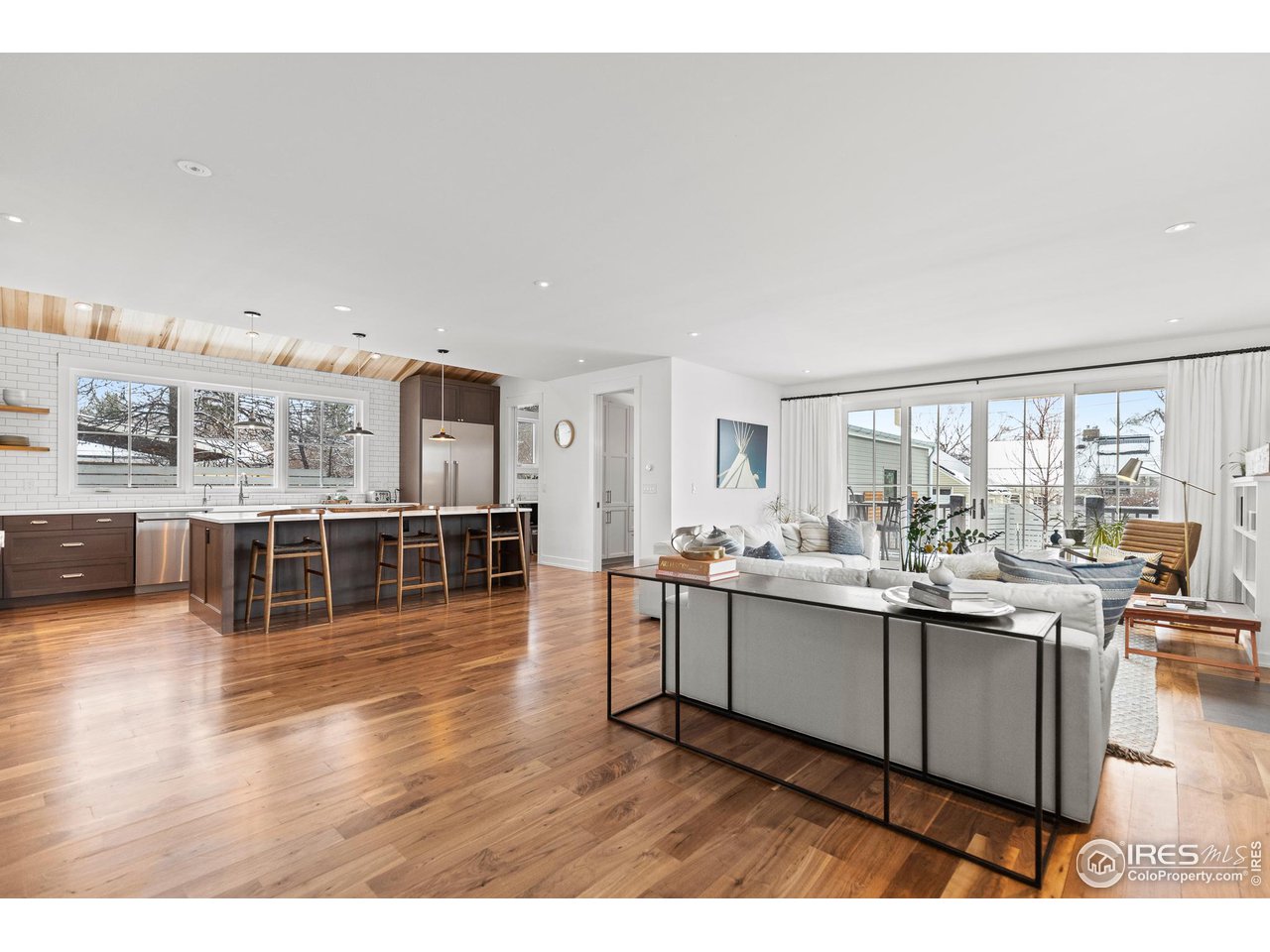 3184 9th Street Boulder, CO 80304 - Photo 8 of 39 a living room with stainless steel appliances kitchen island granite countertop a sink and cabinets