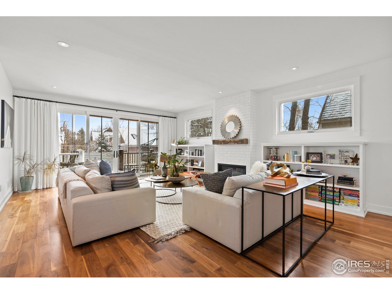 3184 9th Street Boulder, CO 80304 - Photo 9 of 39 a living room with furniture and a large window