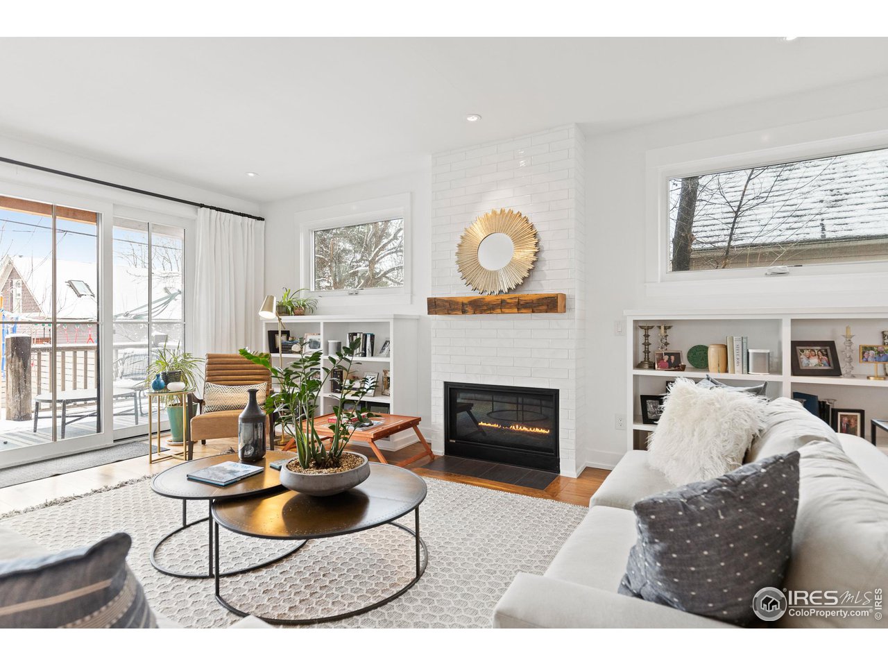 3184 9th Street Boulder, CO 80304 - Photo 10 of 39 a living room with furniture a fireplace and a large window