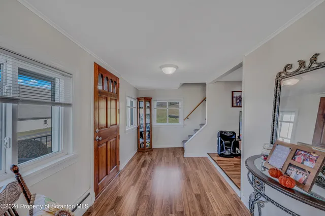 a room with furniture and a wooden floor