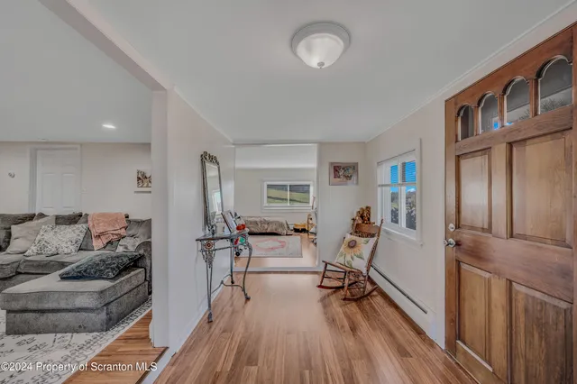 a bedroom with a large bed and a couch