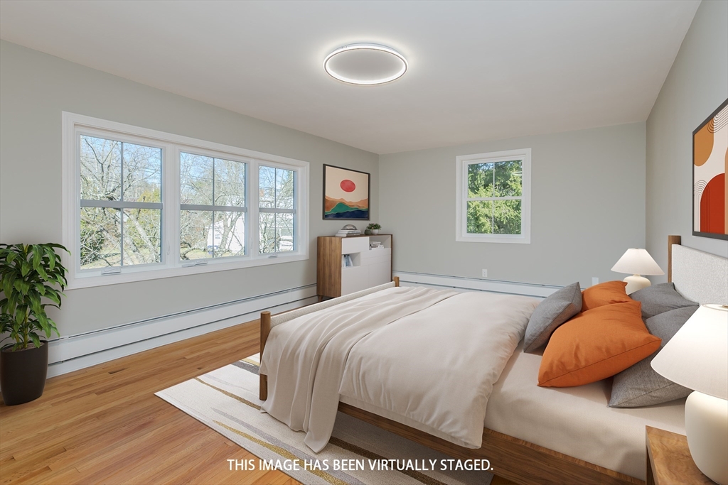 265 Stanley Street Amherst, MA 01002 - Photo 14 of 35 a bedroom with a bed and wooden floor