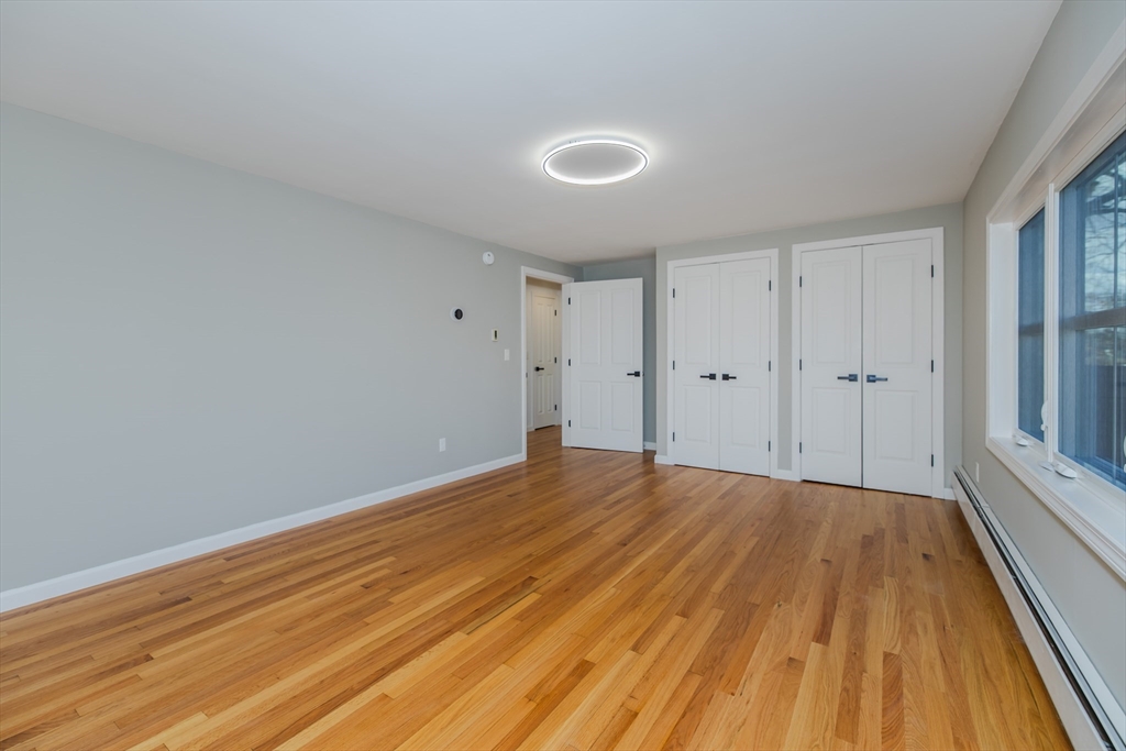 265 Stanley Street Amherst, MA 01002 - Photo 16 of 35 a view of empty room with wooden floor and fan