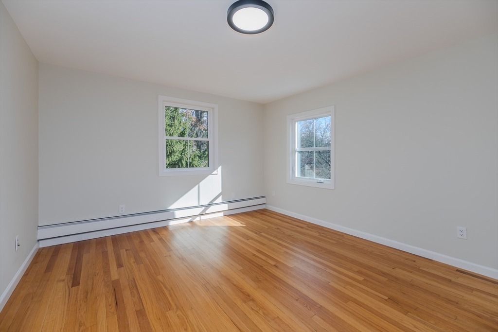 265 Stanley Street Amherst, MA 01002 - Photo 20 of 35 an empty room with wooden floor and windows