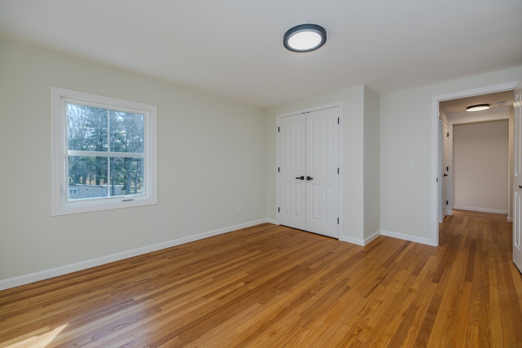 265 Stanley Street Amherst, MA 01002 - Photo 21 of 35 a view of a room with wooden floor and window