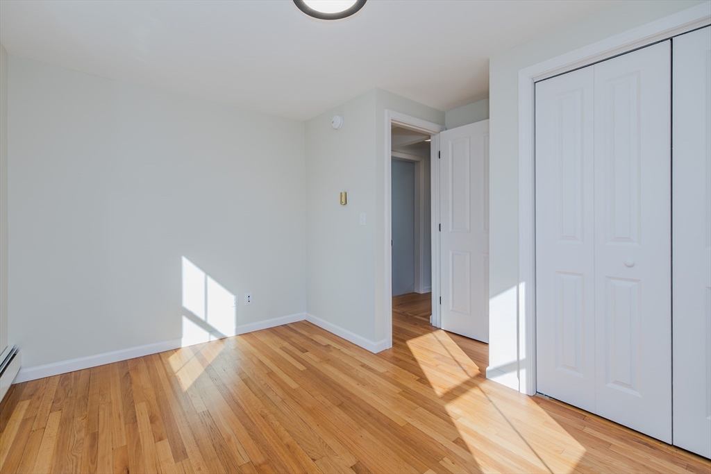 265 Stanley Street Amherst, MA 01002 - Photo 25 of 35 a view of empty room with wooden floor