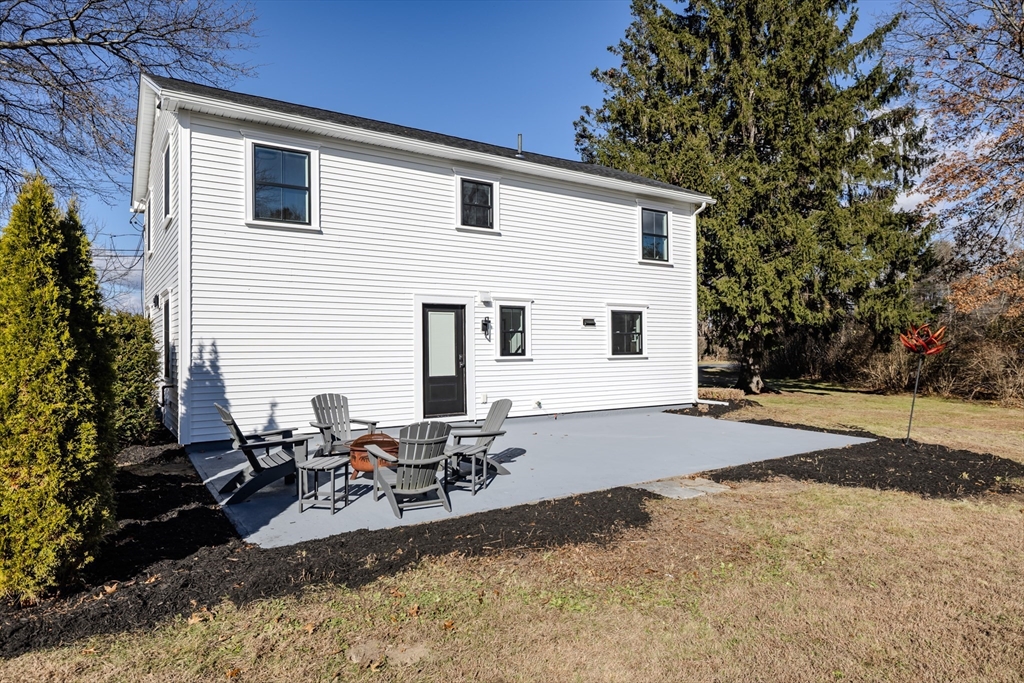 265 Stanley Street Amherst, MA 01002 - Photo 28 of 35 a view of backyard of house with outdoor seating