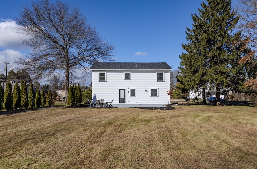 265 Stanley Street Amherst, MA 01002 - Photo 30 of 35 a view of a house with a yard