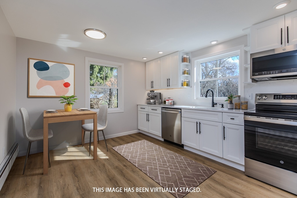 265 Stanley Street Amherst, MA 01002 - Photo 7 of 35 a kitchen with a sink cabinets and window