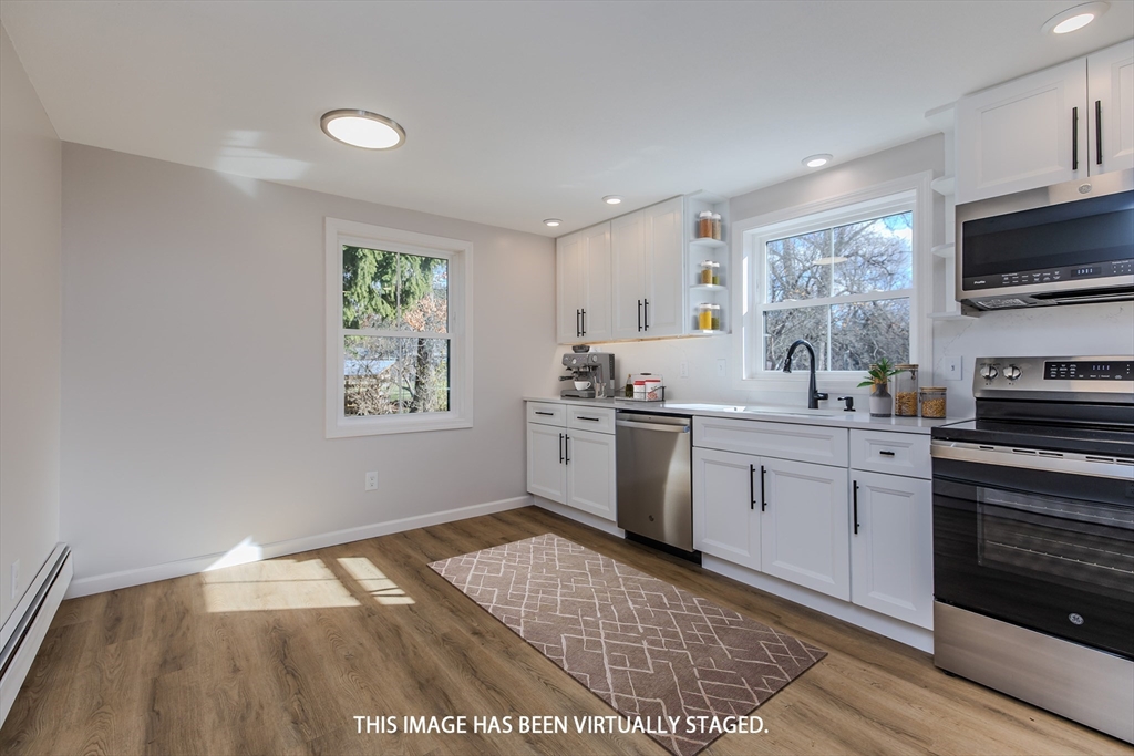 265 Stanley Street Amherst, MA 01002 - Photo 8 of 35 a kitchen with a sink cabinets and window