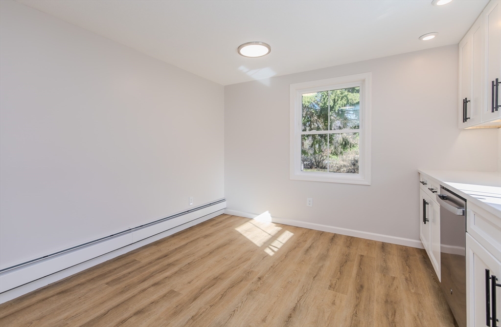265 Stanley Street Amherst, MA 01002 - Photo 9 of 35 an empty room with wooden floor and windows