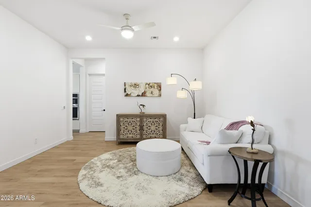 a large white kitchen with cabinets