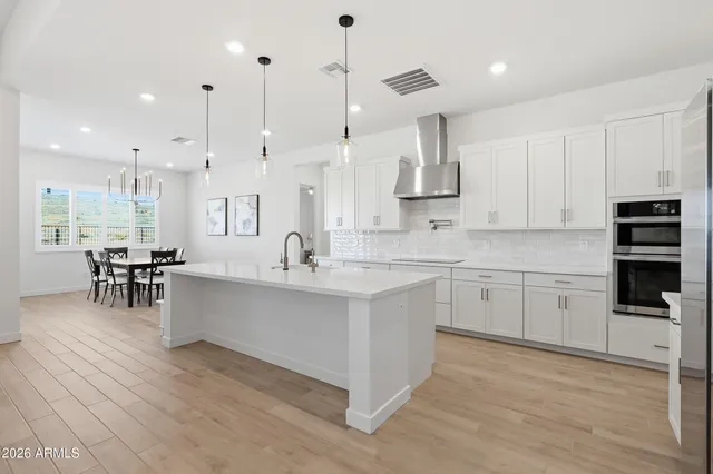 a bedroom with a bed and cabinets
