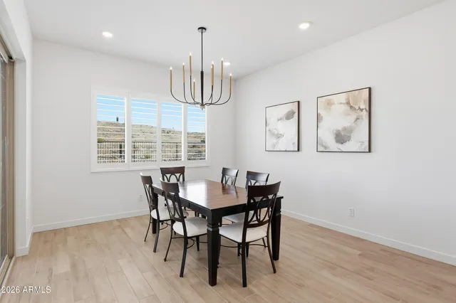 a white bath tub sitting next to a toilet