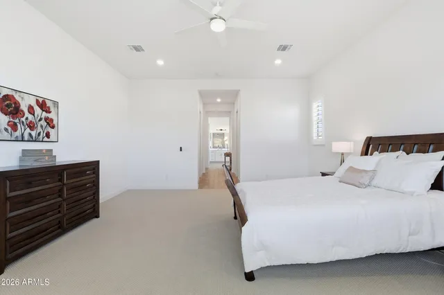 a bathroom with a sink a toilet a shower and a mirror