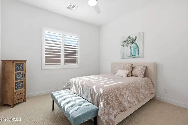 a view of a room with furniture and windows