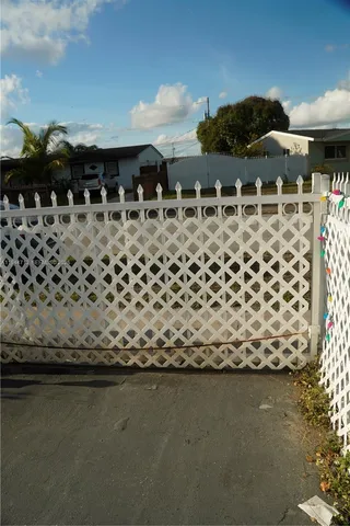 a kitchen with a refrigerator and a stove
