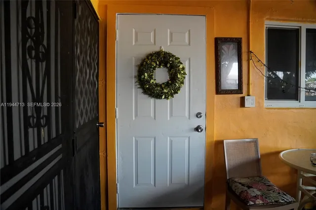 a kitchen with granite countertop a sink a stove and cabinets
