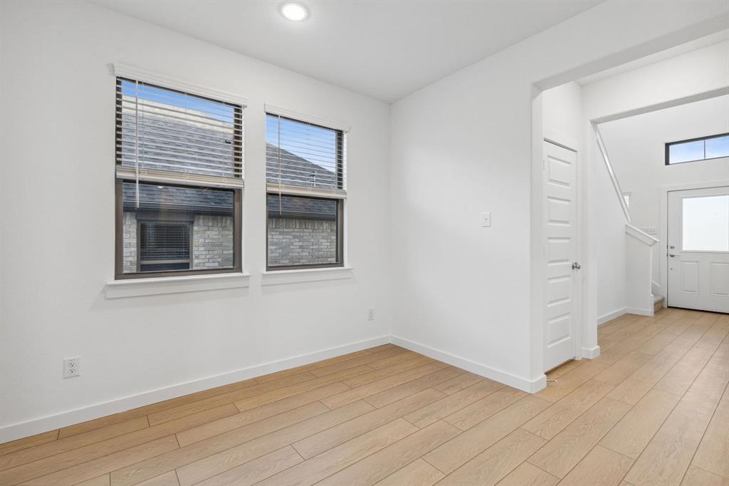 1871 Balfour Bend Forney, TX 75126 - Photo 13 of 30 an empty room with wooden floor and windows